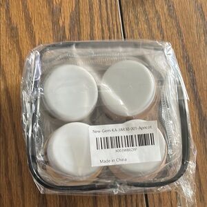 Set of Four Clear and White Storage Jars